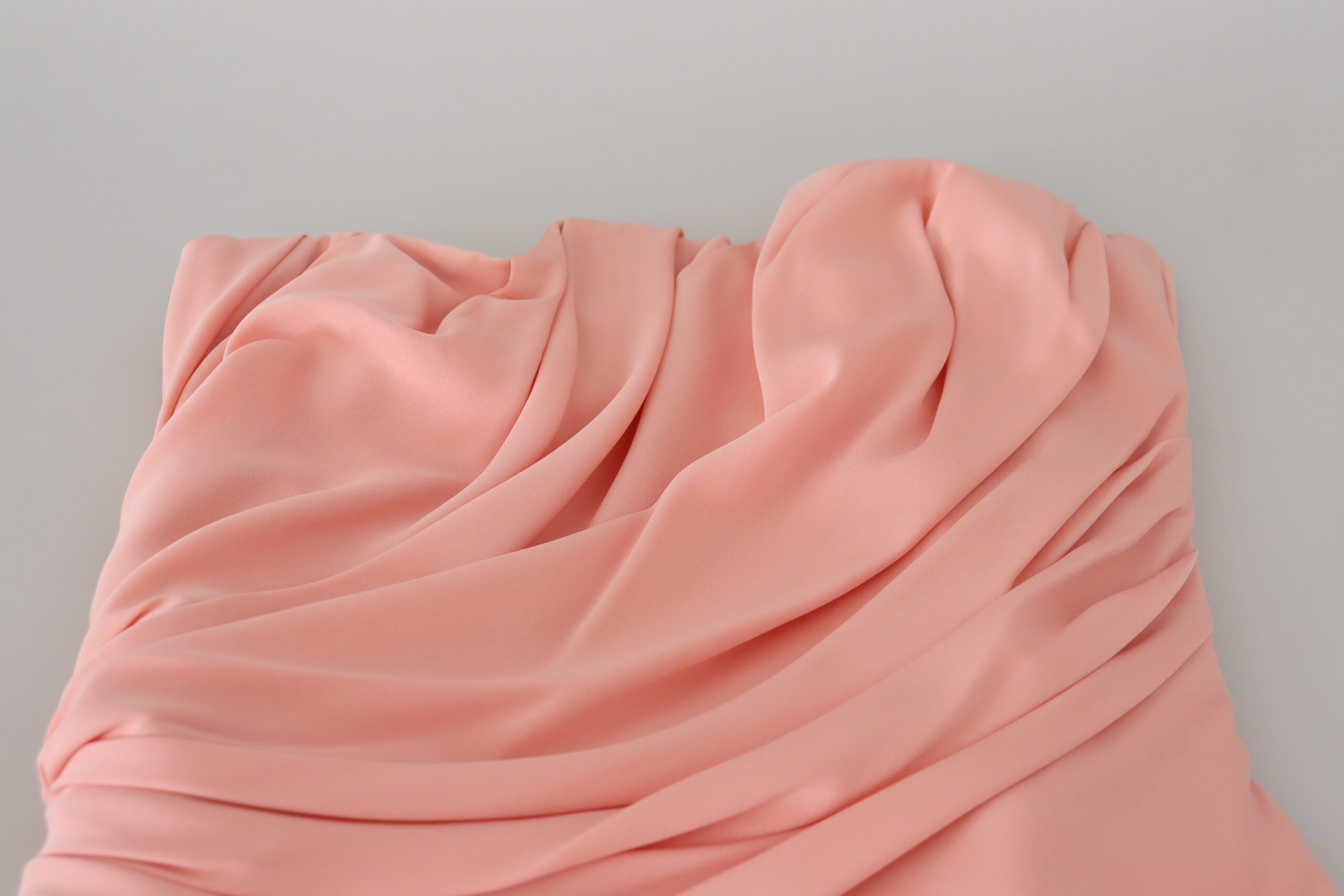 Pink silk stretch strapless sheath dress by Dolce & Gabbana, featuring a fitted design and elegant silhouette.