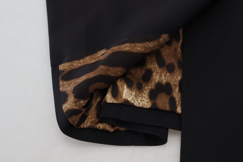 Black Dolce & Gabbana wool stretch sheath mini dress with fitted silhouette and classic design, shown on a model.