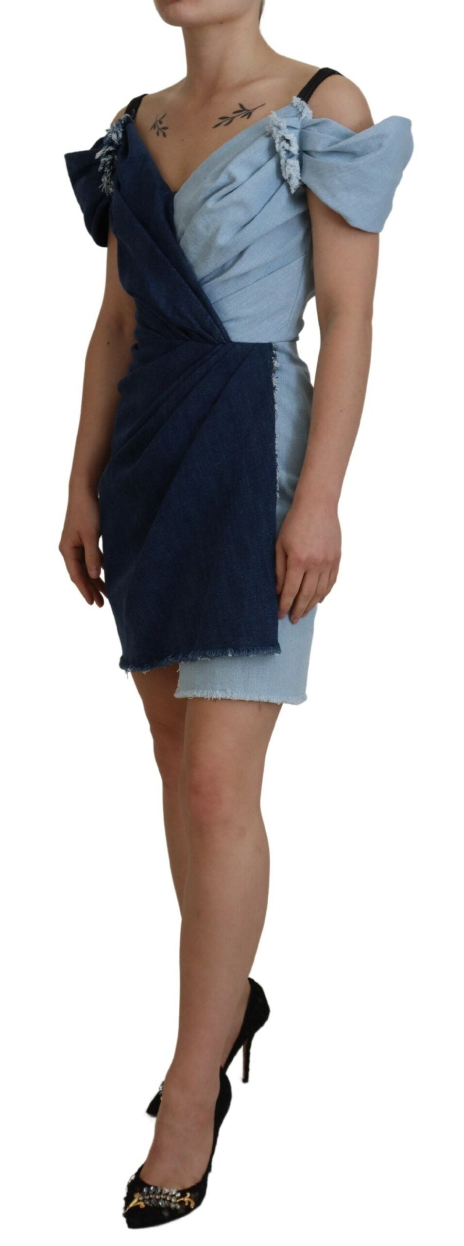 Two-tone blue patchwork denim mini dress by Dolce & Gabbana featuring a stylish, fitted silhouette and detailed stitching.