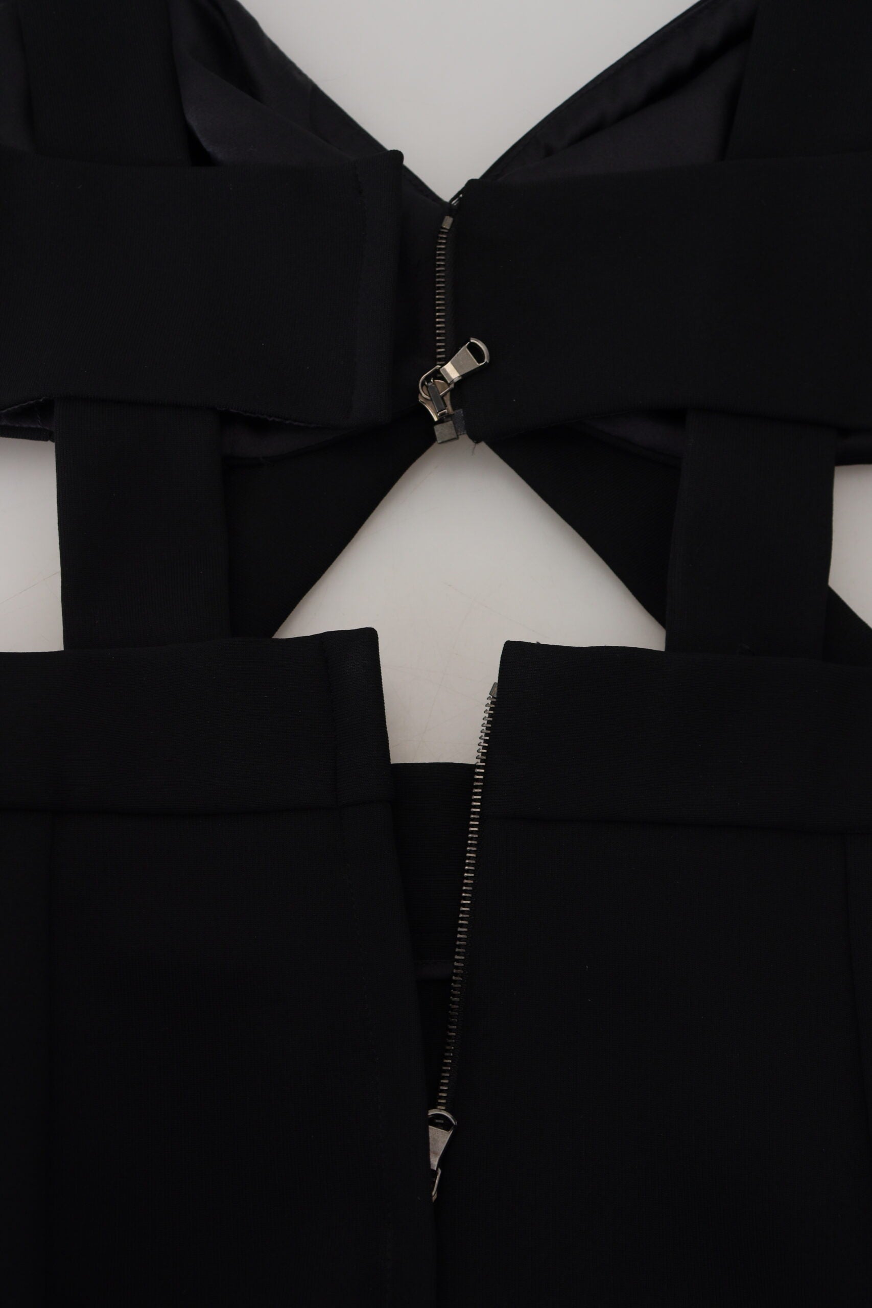Black viscose bodycon sheath midi dress by Dolce & Gabbana, close-up of fitted design and sleek fabric.