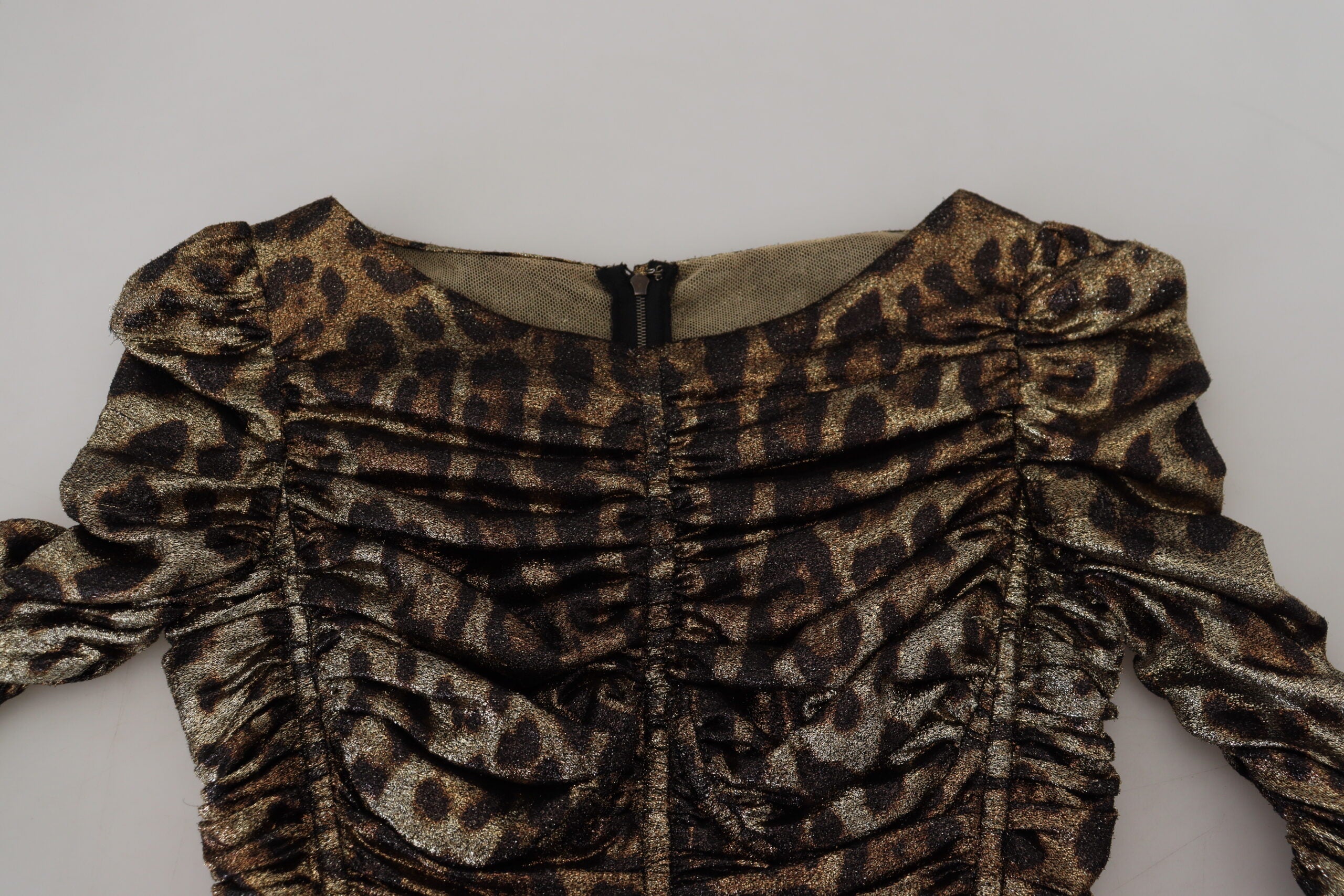 Multicolor leopard print Dolce & Gabbana bodycon sheath midi dress shown on a model, featuring bold animal print and fitted silhouette.