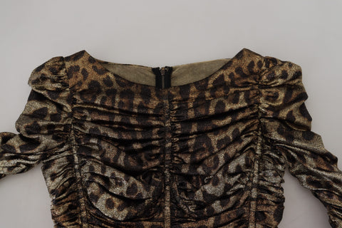 Multicolor leopard print Dolce & Gabbana bodycon sheath midi dress shown on a model, featuring bold animal print and fitted silhouette.