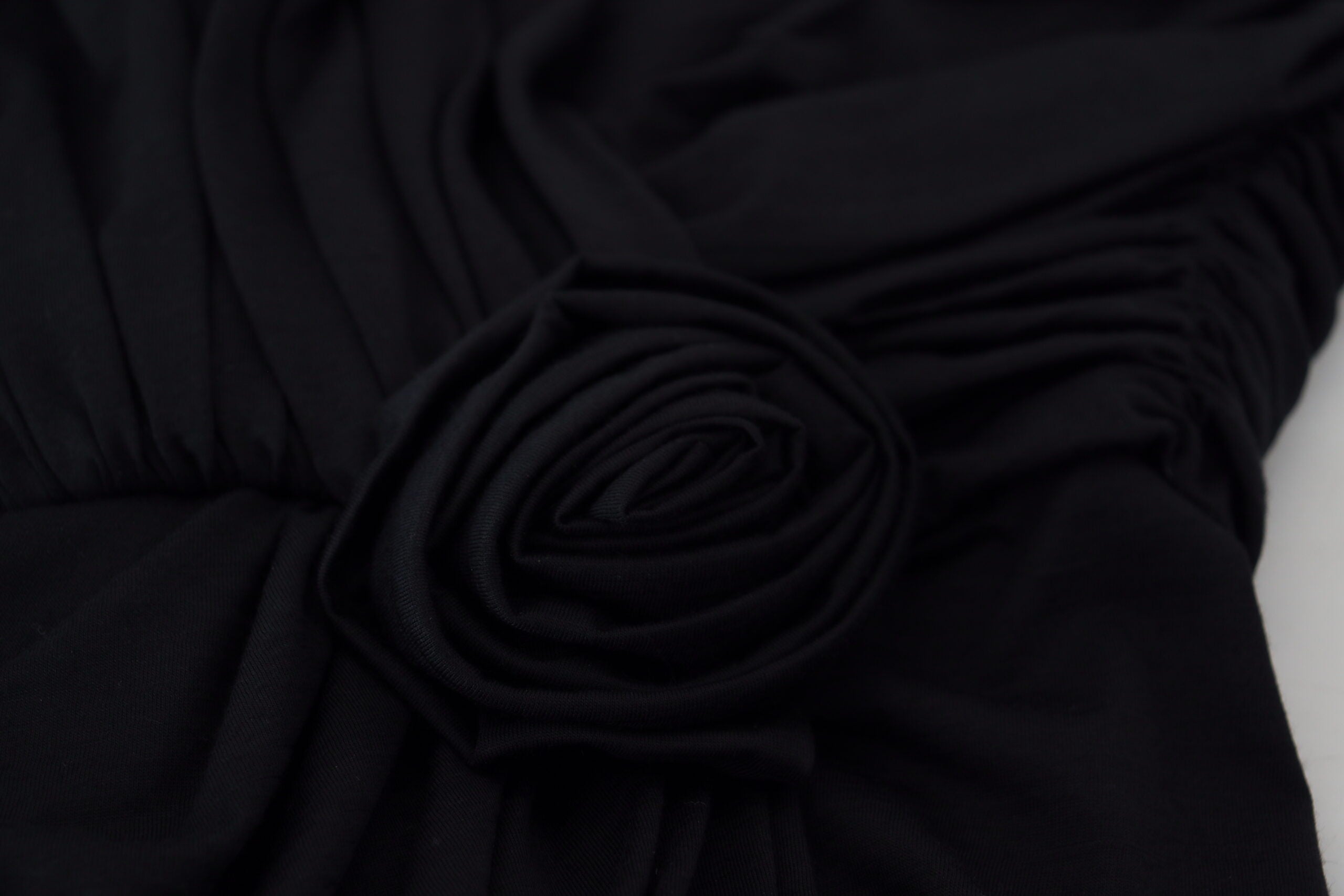 Black wrap sheath wool dress with one shoulder design by Dolce & Gabbana, elegant and form-fitting for formal occasions.