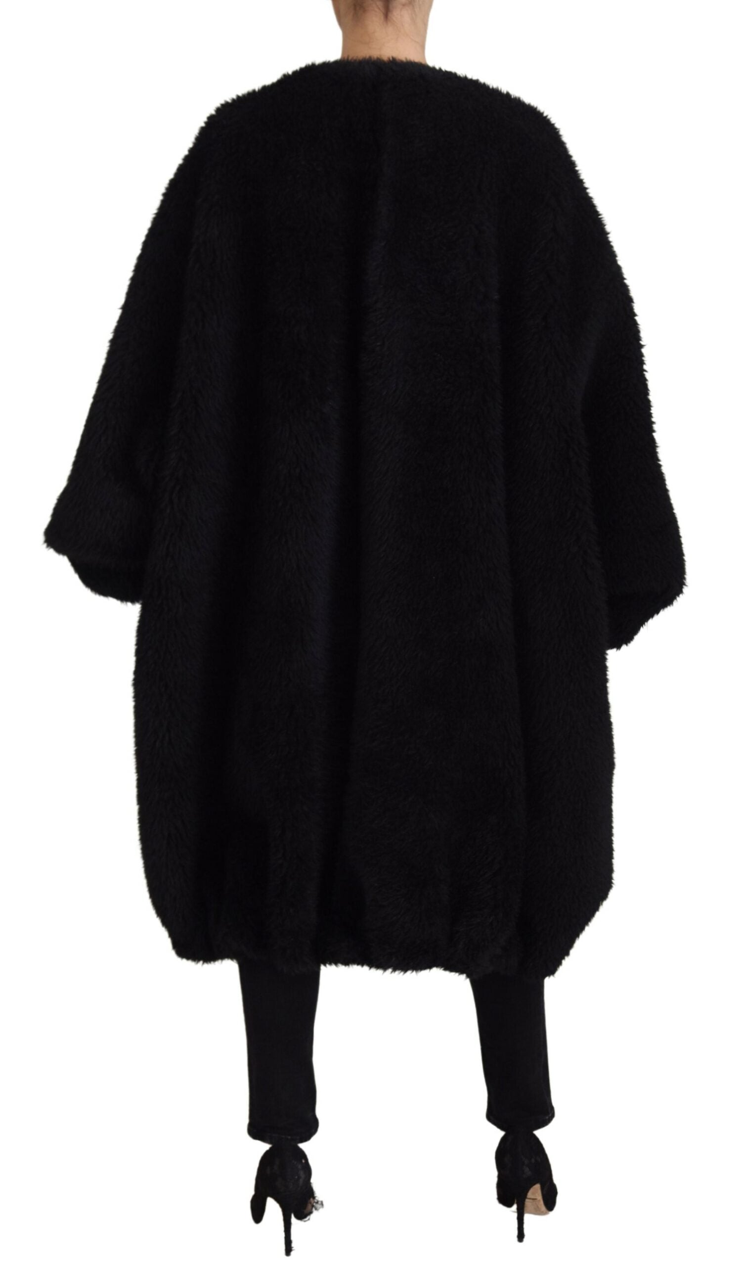 Black Dolce & Gabbana cashmere blend faux fur coat jacket displayed on a hanger with a plush texture and elegant design.