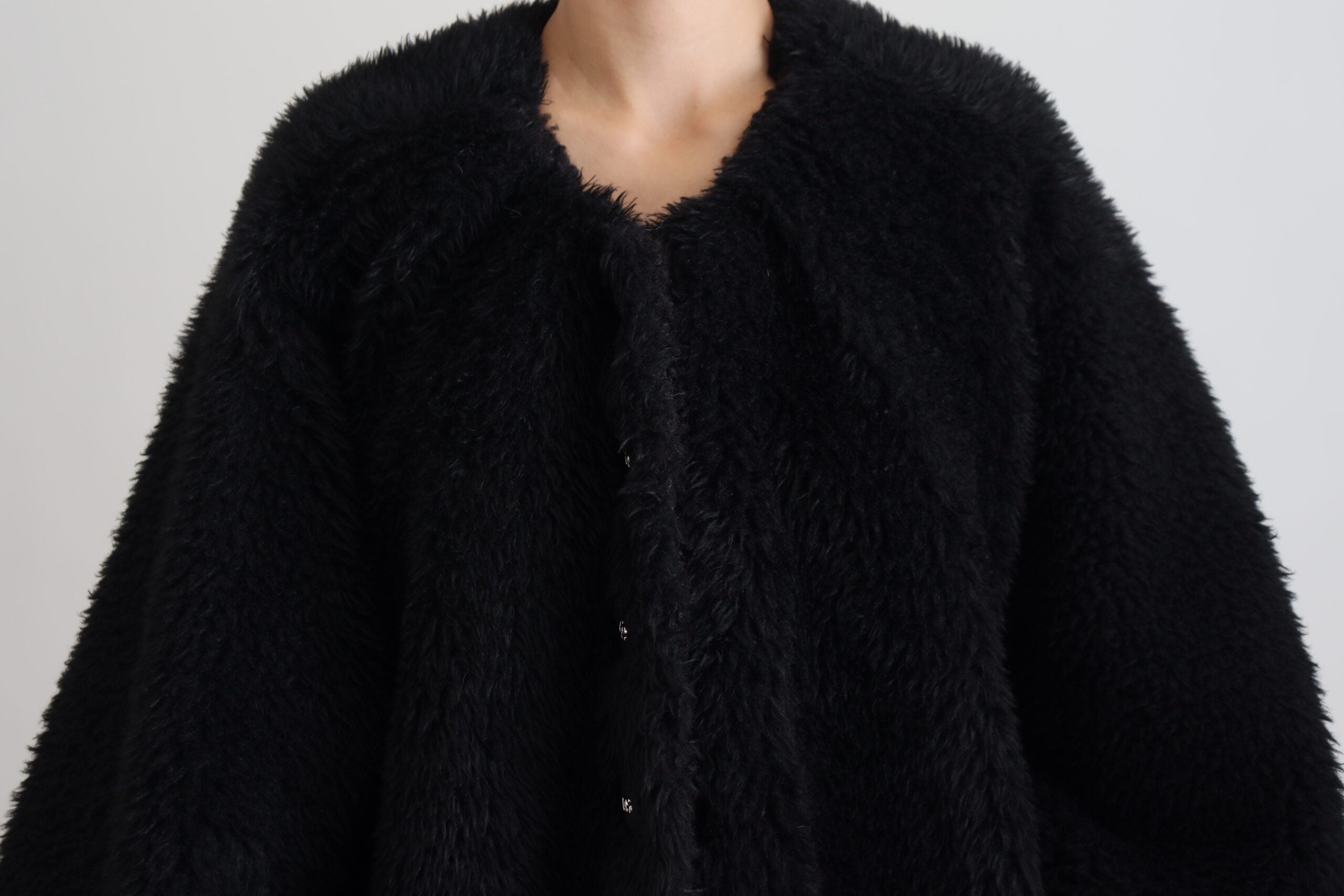 Black Dolce & Gabbana cashmere blend faux fur coat jacket with a plush, luxurious texture and elegant design.