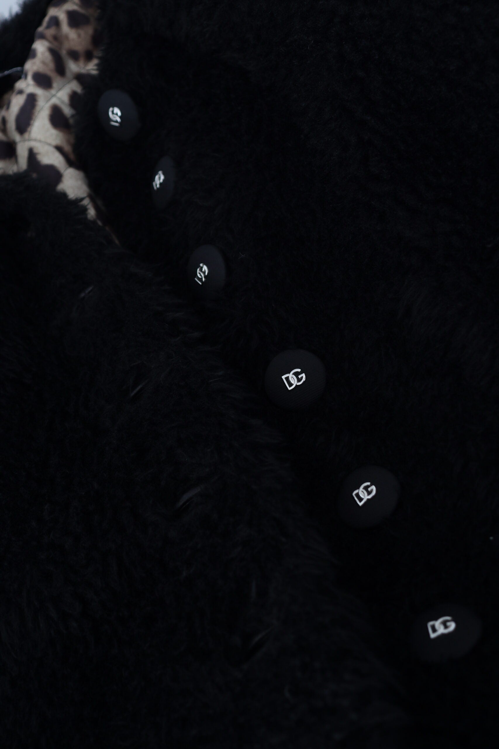 Black cashmere blend faux fur coat jacket by Dolce & Gabbana, featuring plush fur trim and a sleek, stylish silhouette.