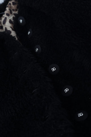 Black cashmere blend faux fur coat jacket by Dolce & Gabbana, featuring plush fur trim and a sleek, stylish silhouette.