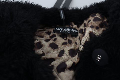Black cashmere blend faux fur coat by Dolce & Gabbana, showing a luxurious, soft-textured coat with a classic collar and full-length sleeves.