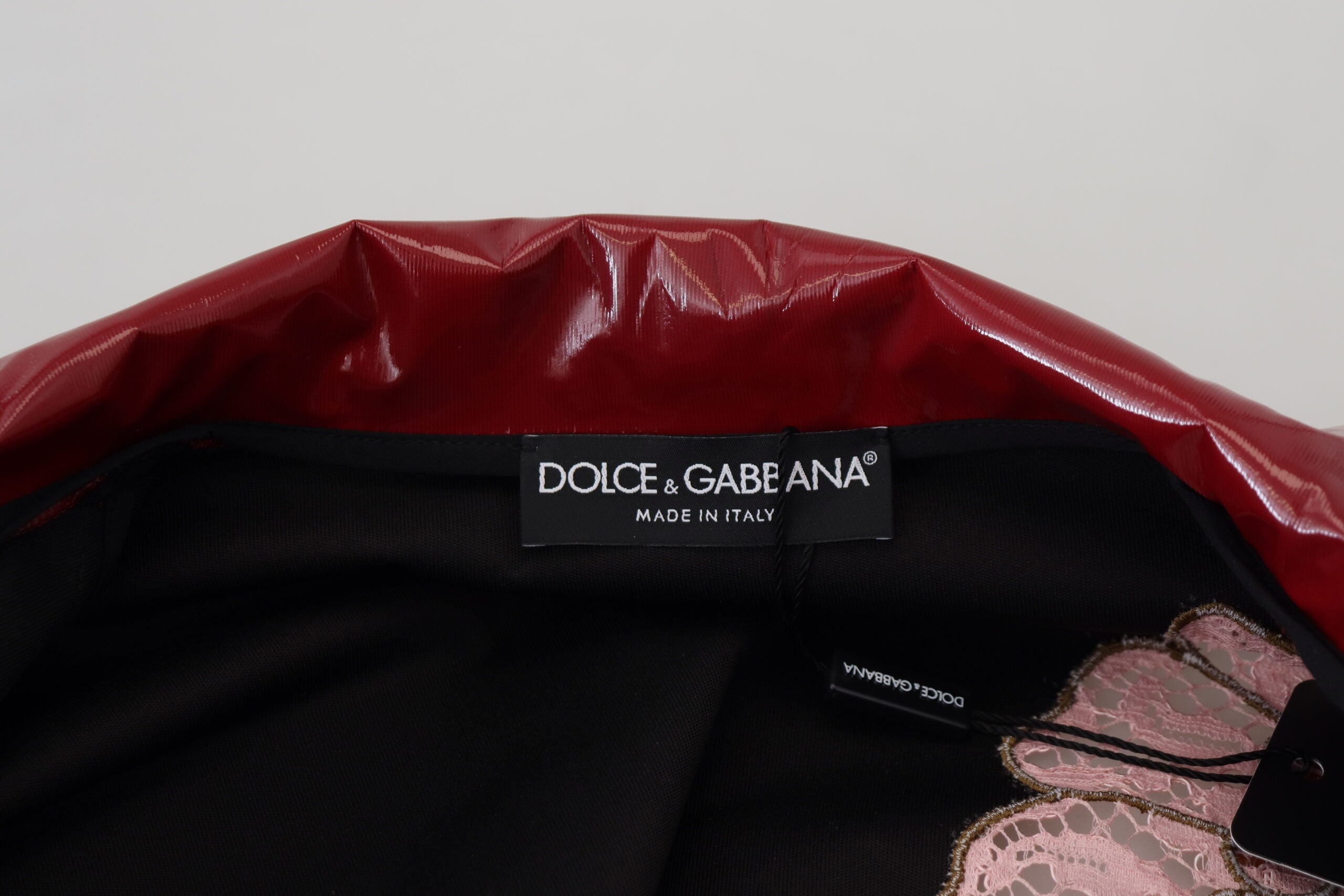 Maroon floral full-zip polyester women's jacket by Dolce & Gabbana, featuring a stylish floral pattern and comfortable fit.