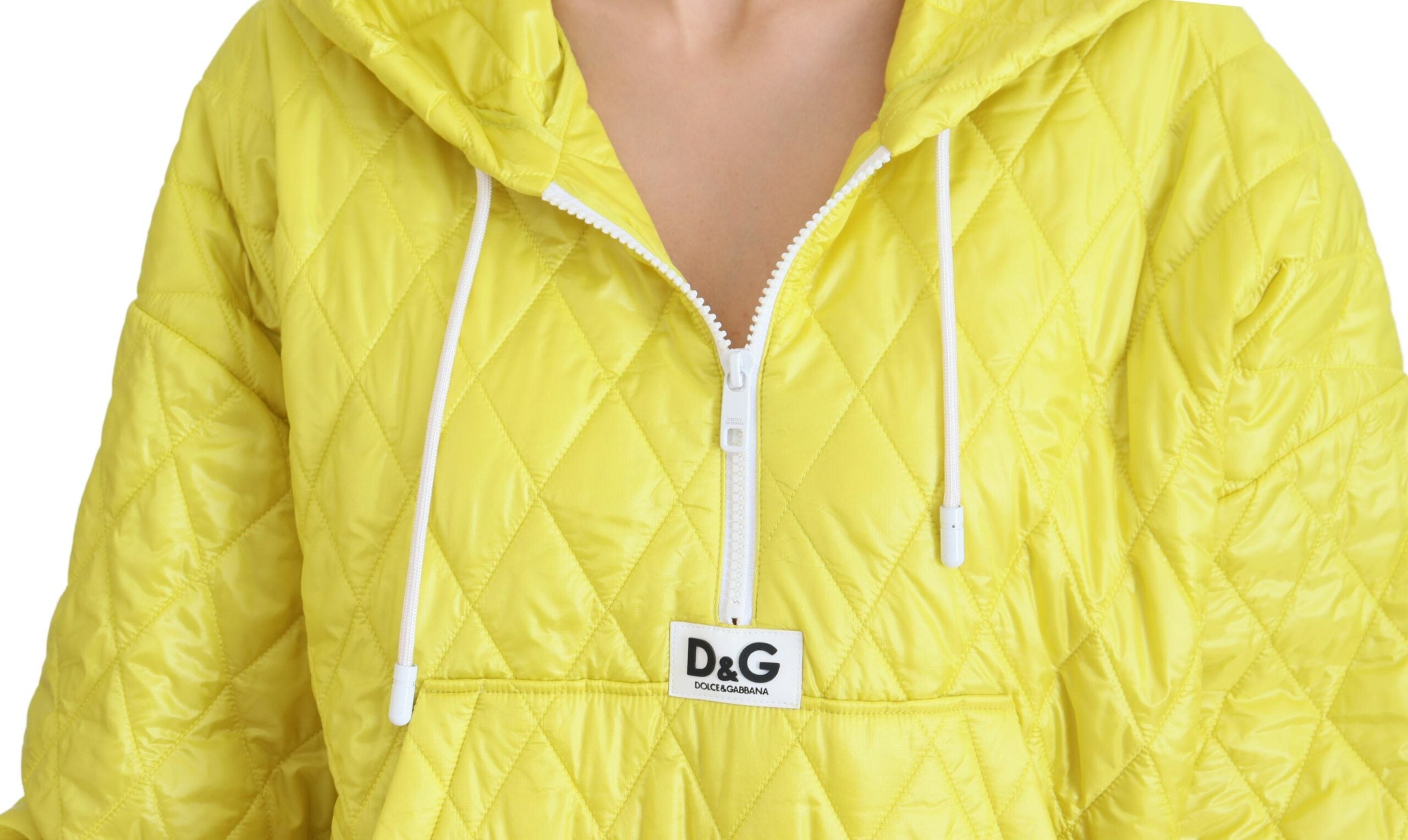 Yellow nylon quilted hooded pullover jacket by Dolce & Gabbana, featuring a quilted design and hood, displayed on a hanger.