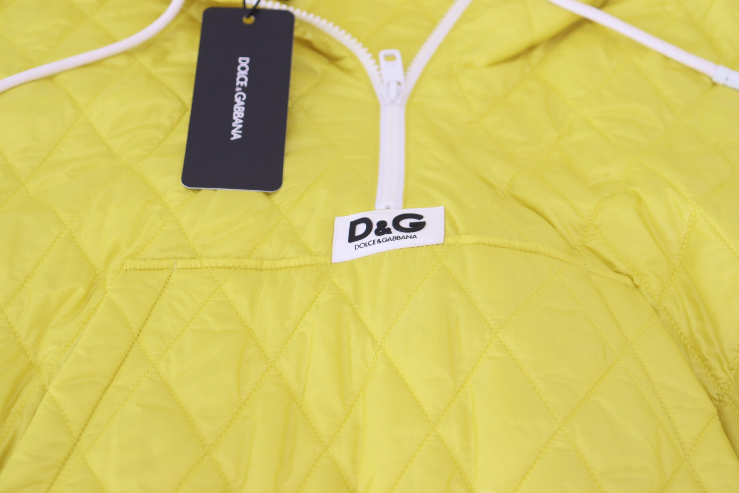 Yellow nylon quilted hooded pullover jacket by Dolce & Gabbana, featuring a stylish quilted design and hood.