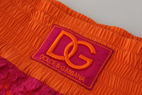 Pink orange lace cotton high waist shorts by Dolce & Gabbana with delicate lace detailing and a stylish high-rise fit.