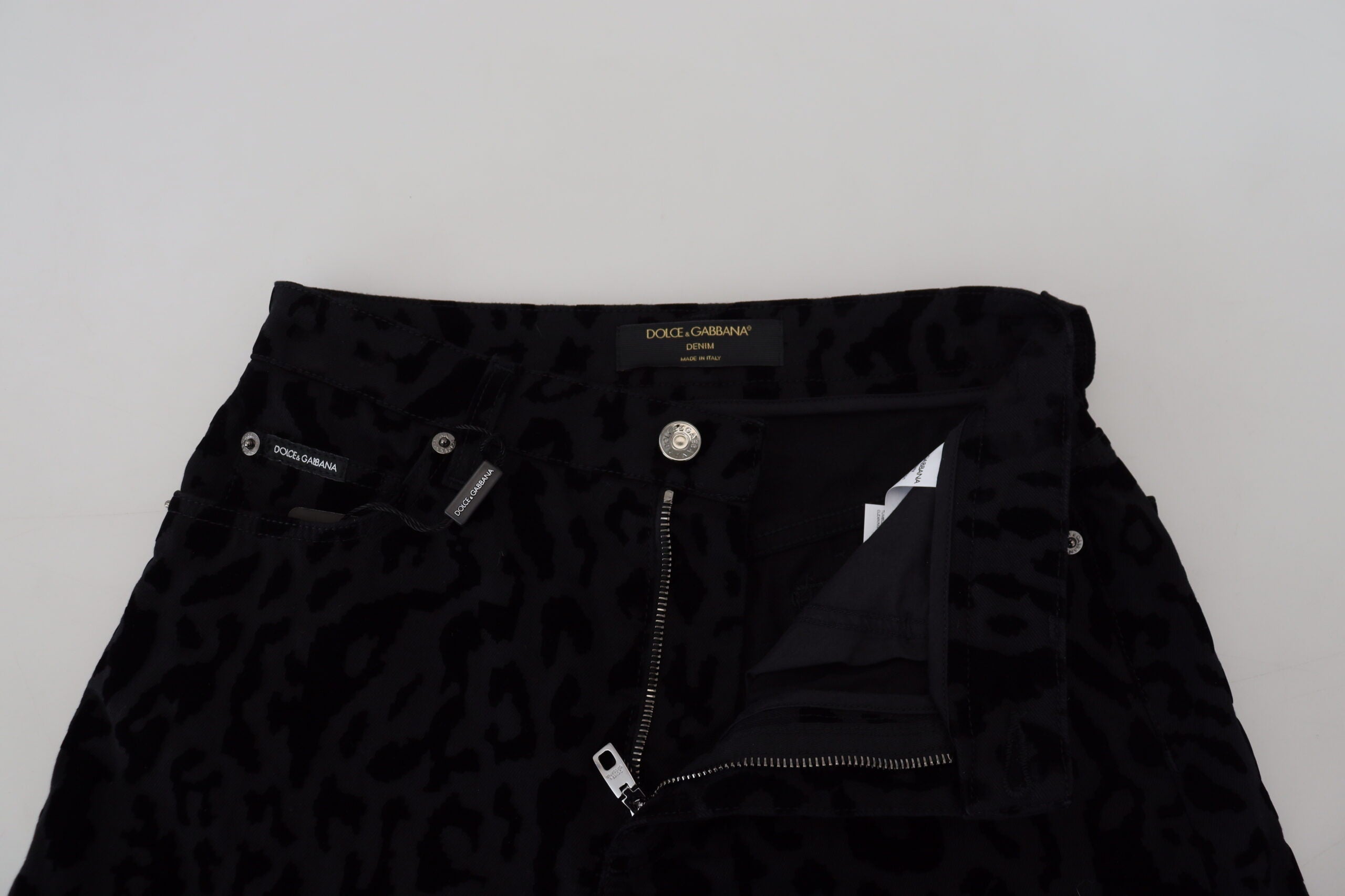 Black denim cotton stretch hot pants shorts by Dolce & Gabbana, showing fitted design and stylish detailing.