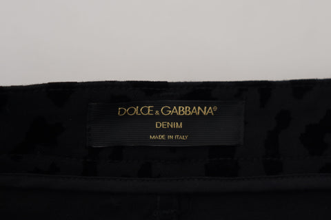 Black denim cotton stretch hot pants shorts by Dolce & Gabbana, showing fitted waist and stylish casual design.