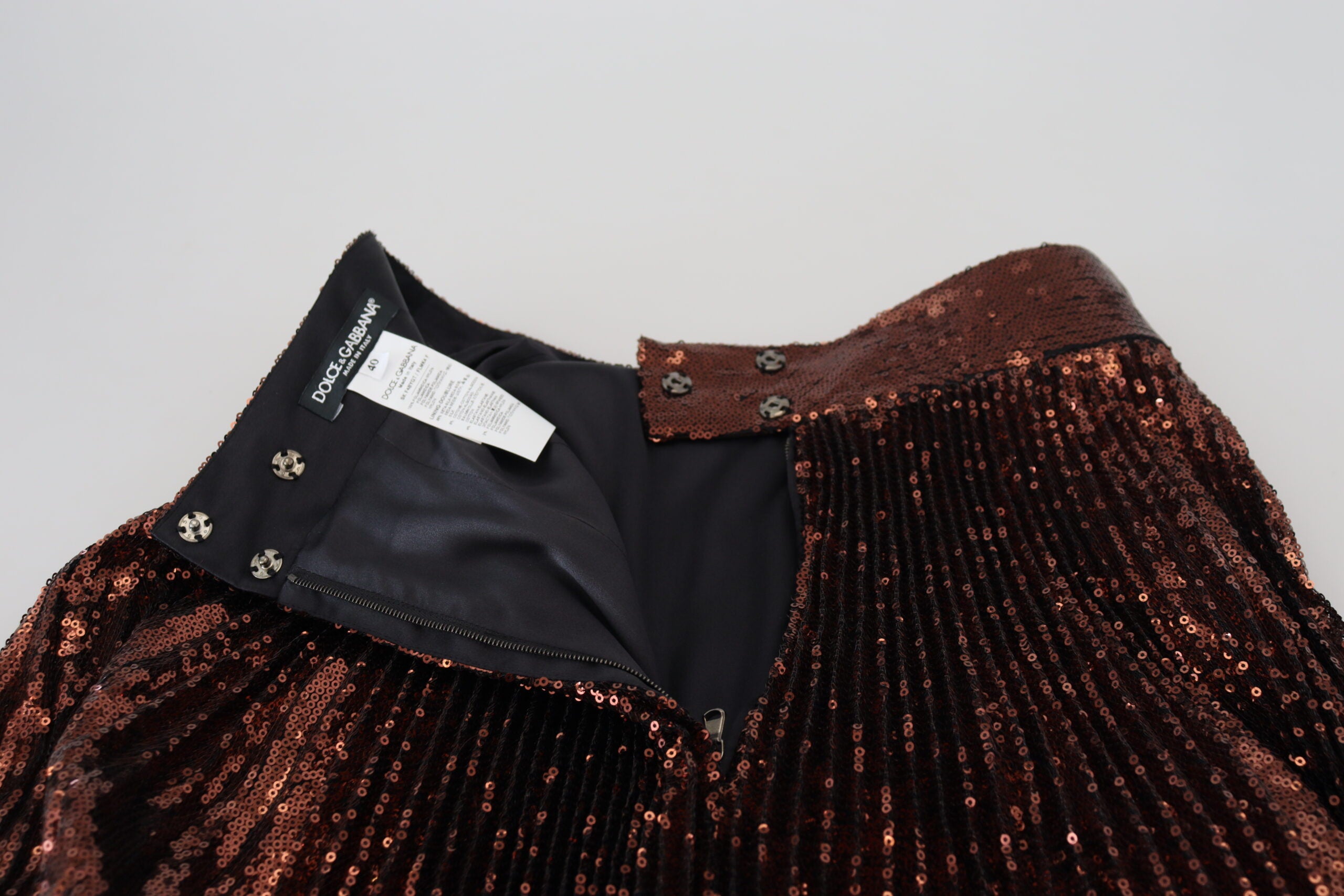 Bronze sequined high waist A-line maxi skirt by Dolce & Gabbana, flowing fabric with shimmering sequins and a fitted waist.