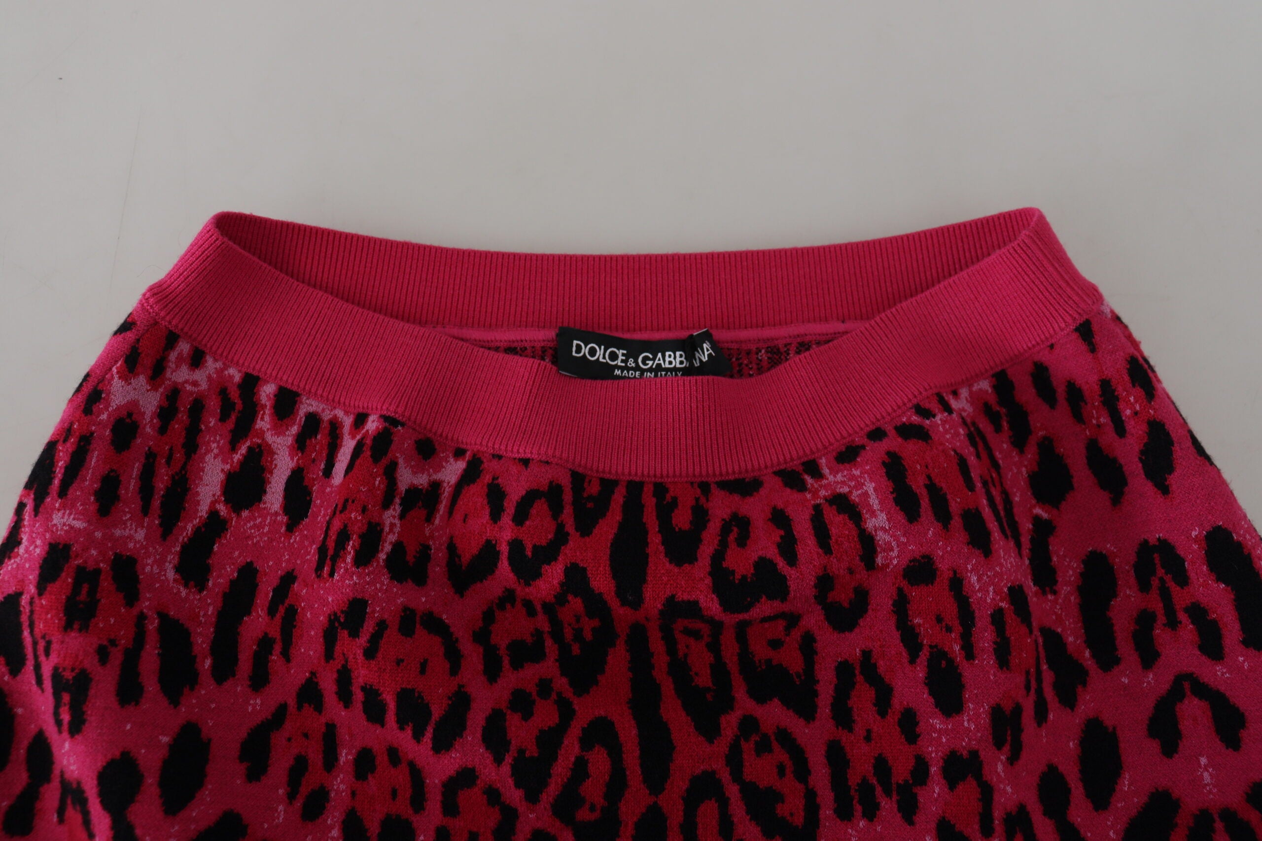 Pink leopard print high waist A-line mini skirt by Dolce & Gabbana, showcasing the bold pattern and stylish fit.