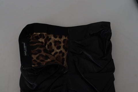 Black lambskin leather A-line mini skirt by Dolce & Gabbana, showing smooth texture and stylish silhouette.