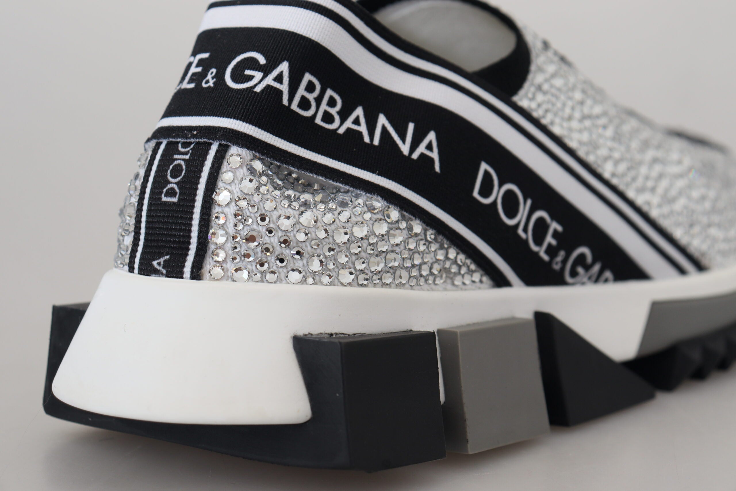 Dolce & Gabbana silver rhinestone Sorrento sneakers with sparkling embellishments and white rubber soles.