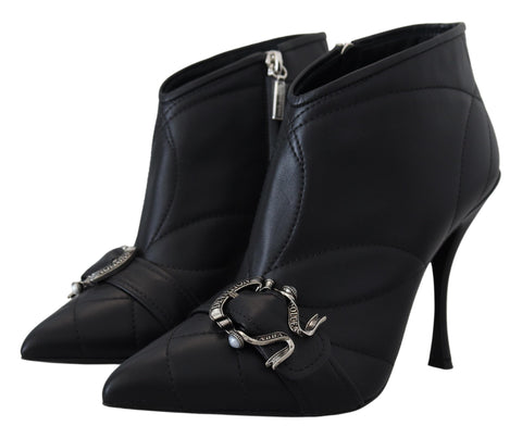 Black Devotion quilted buckled ankle boots by Dolce & Gabbana with chunky heel and textured leather finish.