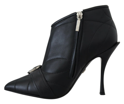 Black Devotion quilted buckled ankle boots by Dolce & Gabbana, featuring a stylish quilted design and buckle accents.