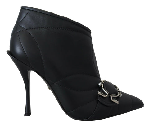 Black Devotion quilted ankle boots with buckled straps by Dolce & Gabbana, featuring a stylish quilted design and ankle height.