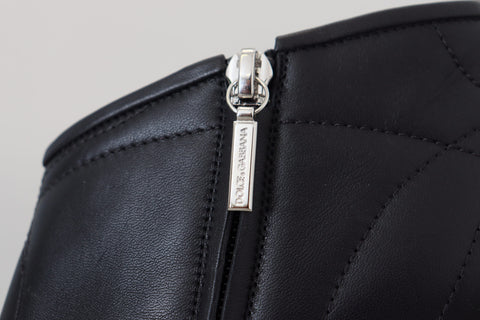 Black Devotion quilted buckled ankle boots by Dolce & Gabbana with pointed toe and chunky heel, featuring quilted leather design and buckle accents.