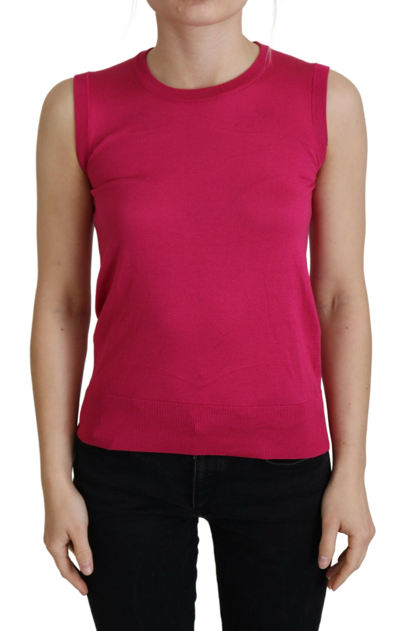 Pink silk Dolce & Gabbana vest pullover crewneck tank top, close-up view showing smooth fabric and stylish design.