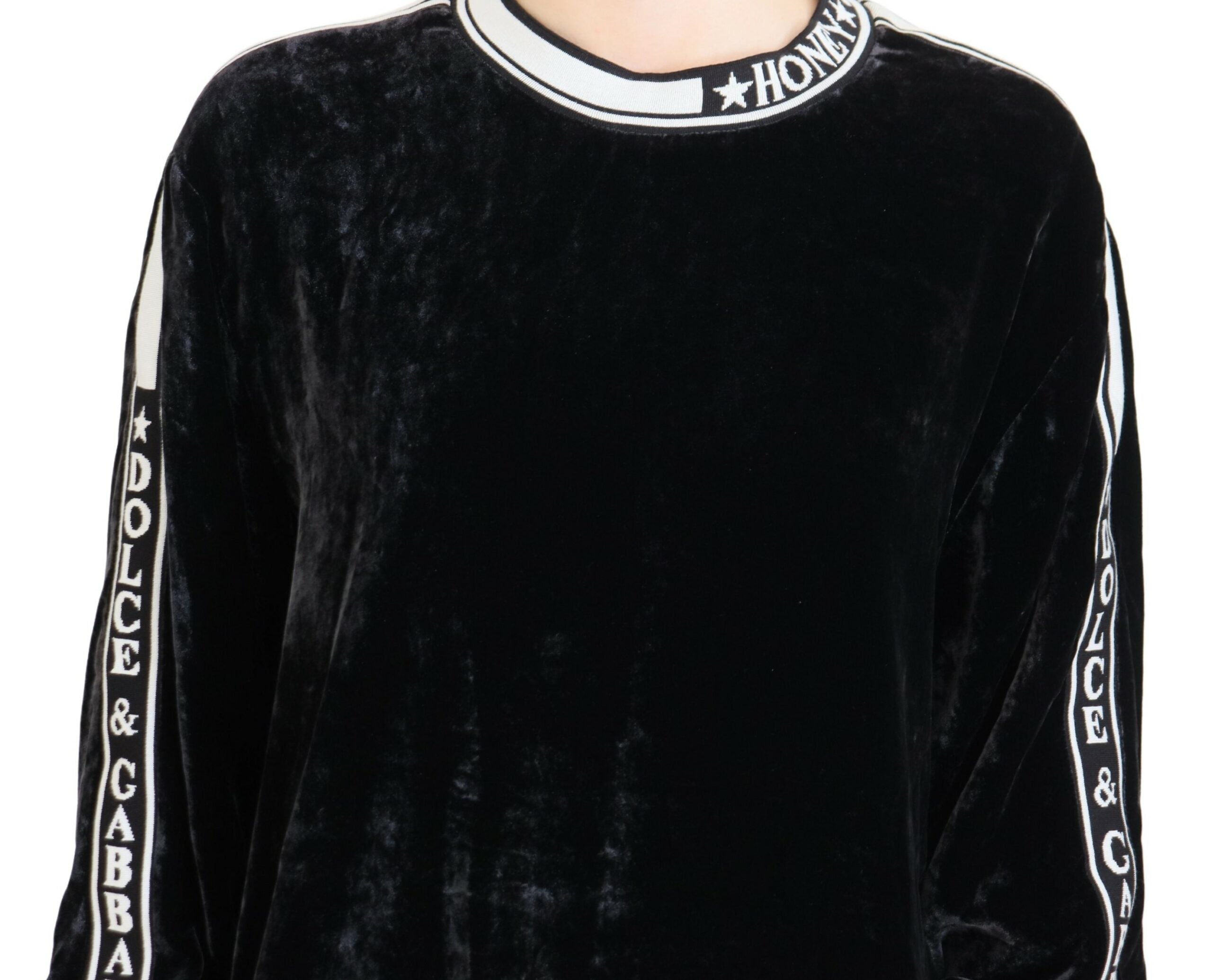 Black velvet crewneck pullover sweater by Dolce & Gabbana, close-up showing soft fabric and classic design.