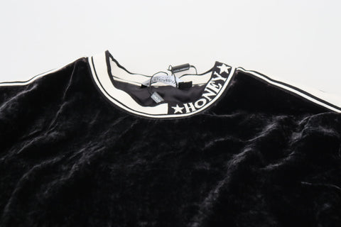 Black velvet crewneck pullover sweater by Dolce & Gabbana, close-up of soft fabric and classic fit.