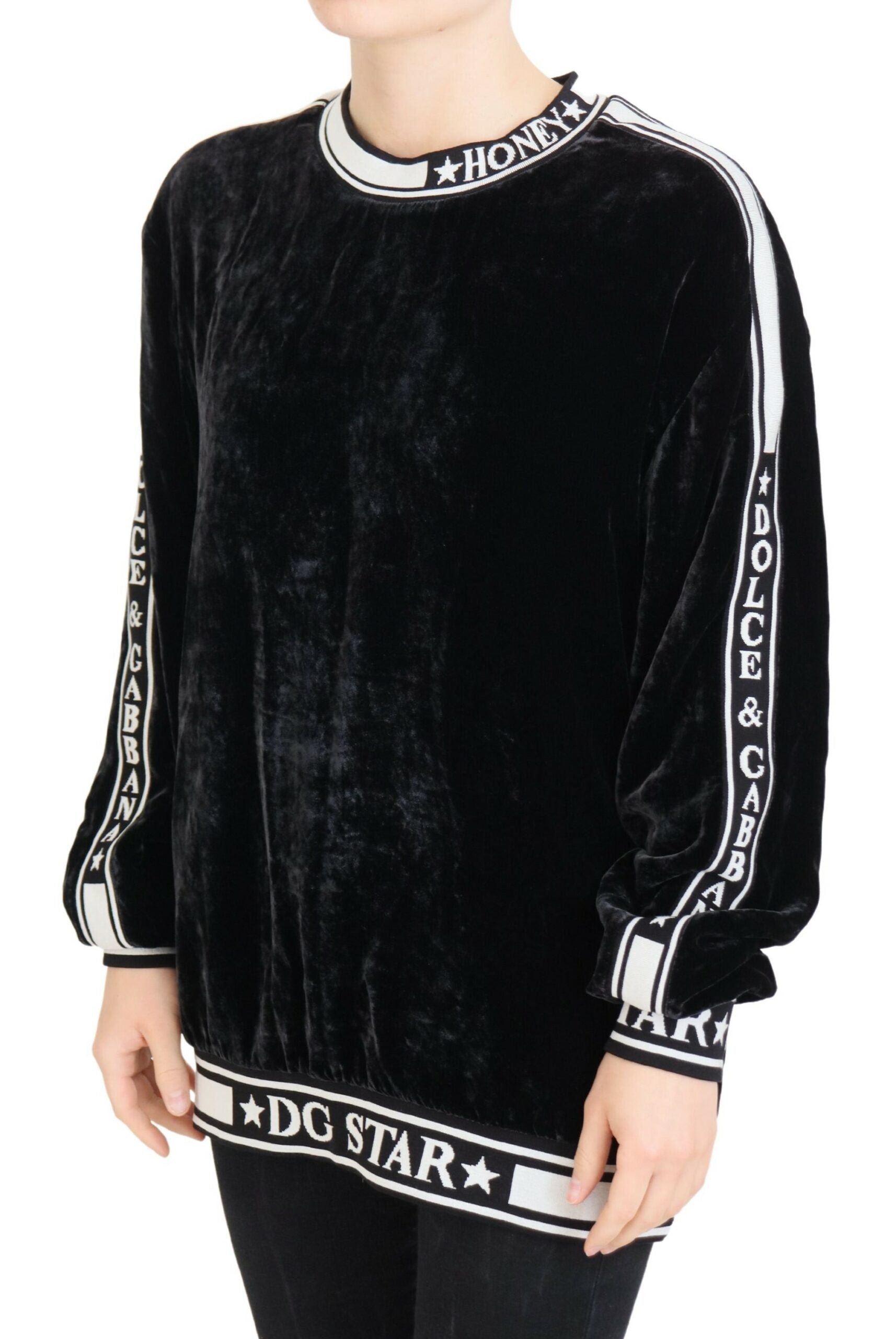 Black velvet crewneck pullover sweater by Dolce & Gabbana, featuring a smooth, luxurious fabric and classic fit.