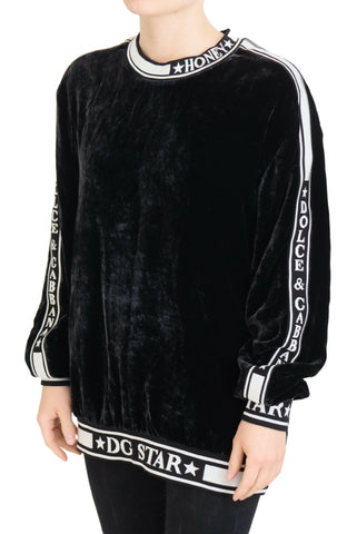 Black velvet crewneck pullover sweater by Dolce & Gabbana, featuring a smooth, luxurious fabric and classic fit.