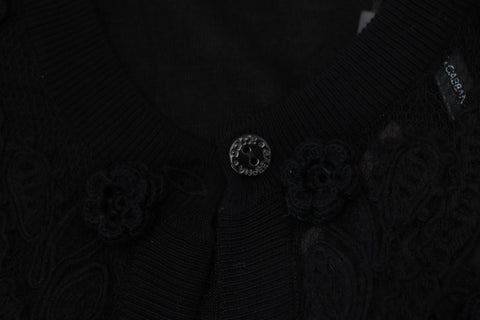 Black floral lace cardigan sweater by Dolce & Gabbana with buttons, featuring intricate lace detailing and a fitted design.