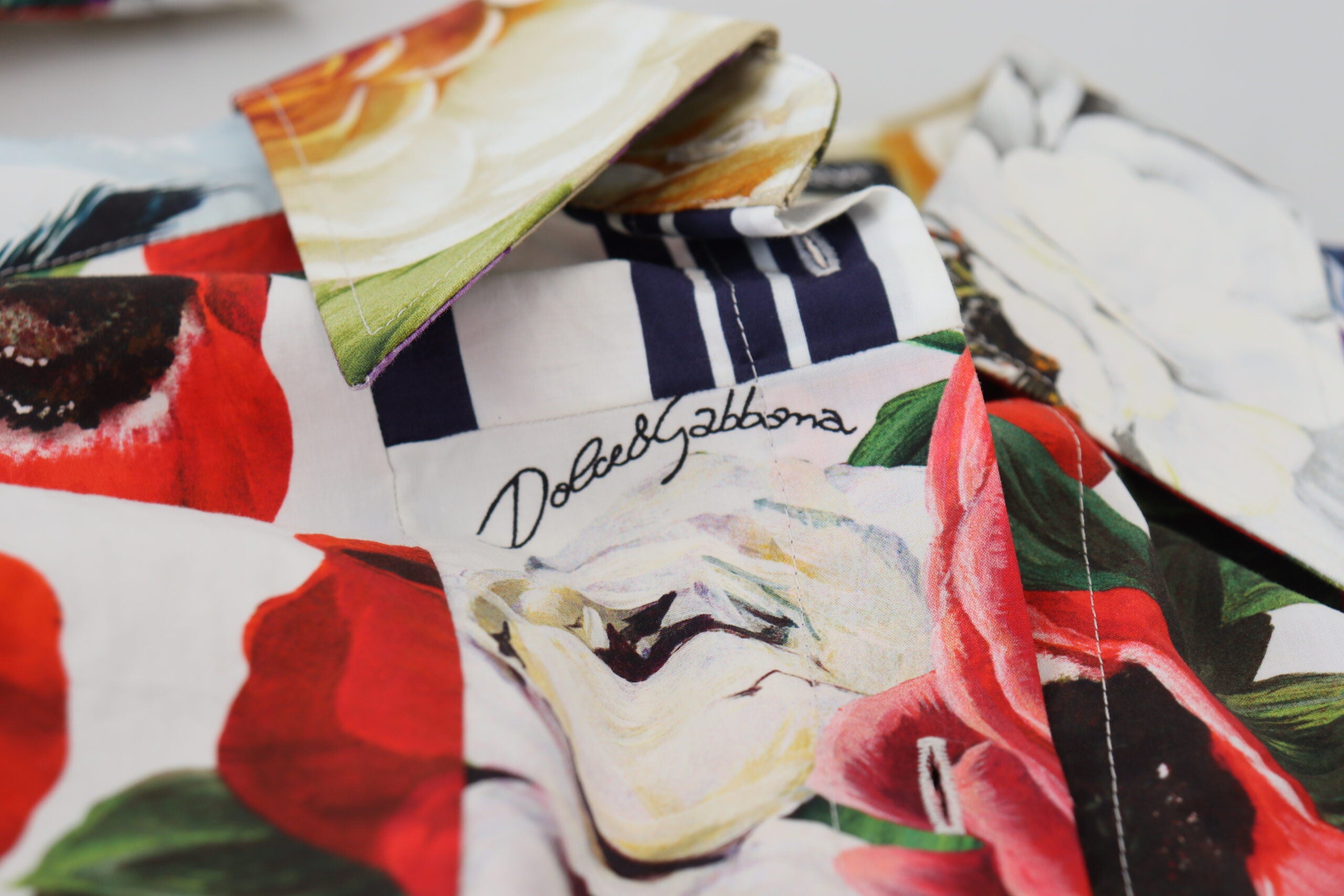Multicolor floral cotton blouse with a collar from Dolce & Gabbana, featuring vibrant floral patterns and a tailored design.