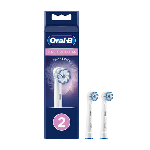 Two Oral-B Sensitive Clean replacement toothbrush heads by Jag Couture London - New York, designed for gentle cleaning.