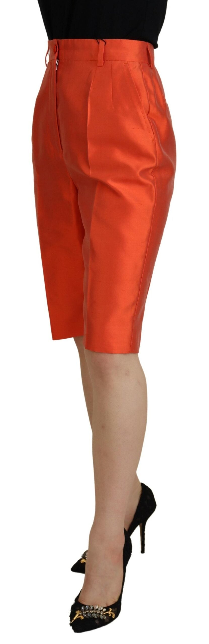 Orange silk high-waist cropped pants by Dolce & Gabbana displayed on a model against a plain background.