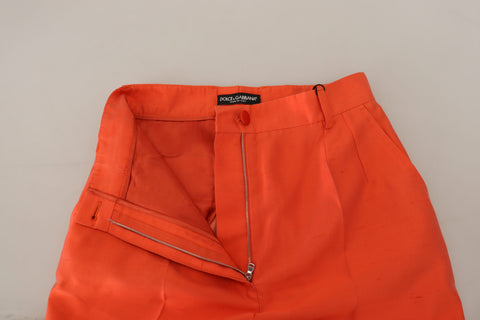 Orange silk high-waist cropped pants by Dolce & Gabbana, featuring a tailored fit and elegant design.