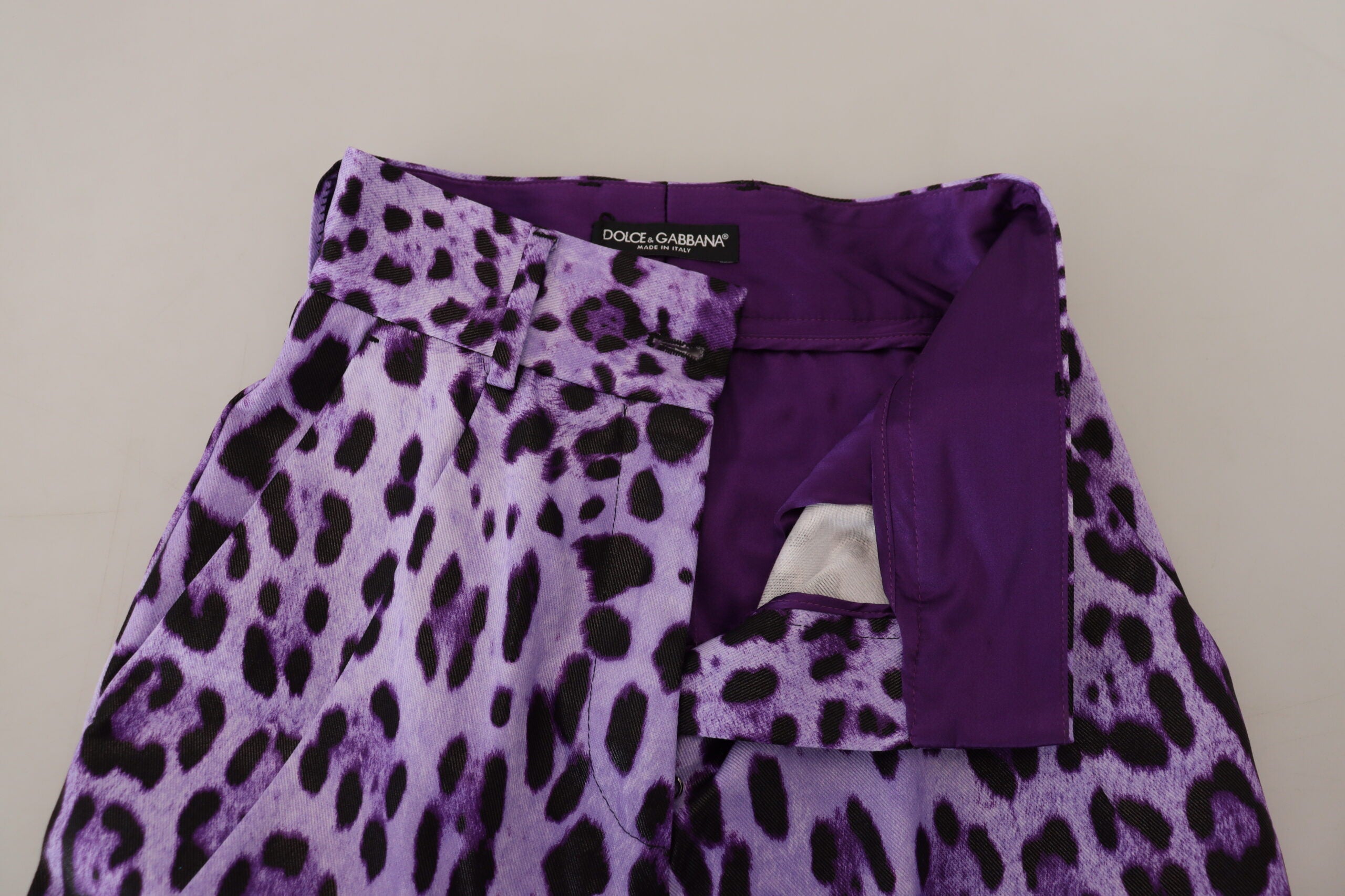 Purple leopard print high waist pants by Dolce & Gabbana, featuring a stylish design and tailored fit.