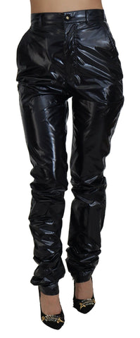 Black nylon high waist skinny pants by Dolce & Gabbana, close-up of sleek, fitted design with smooth fabric and high-rise waist.