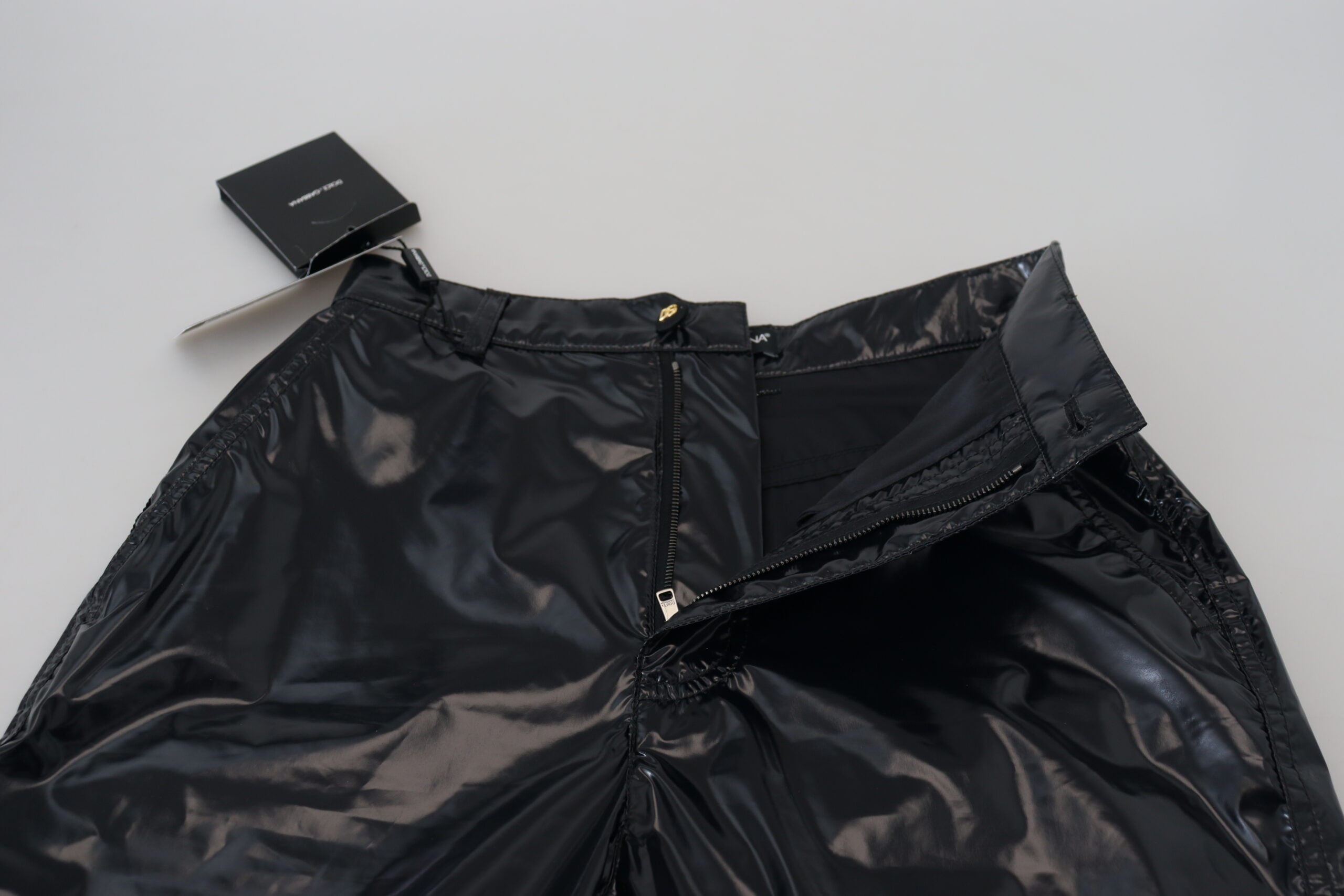 Black nylon high waist skinny pants from Dolce & Gabbana, close-up view showing sleek fit and smooth fabric.
