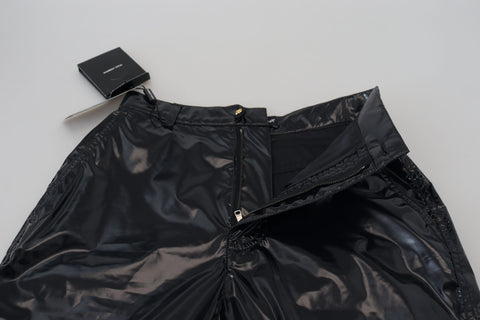 Black nylon high waist skinny pants from Dolce & Gabbana, close-up view showing sleek fit and smooth fabric.