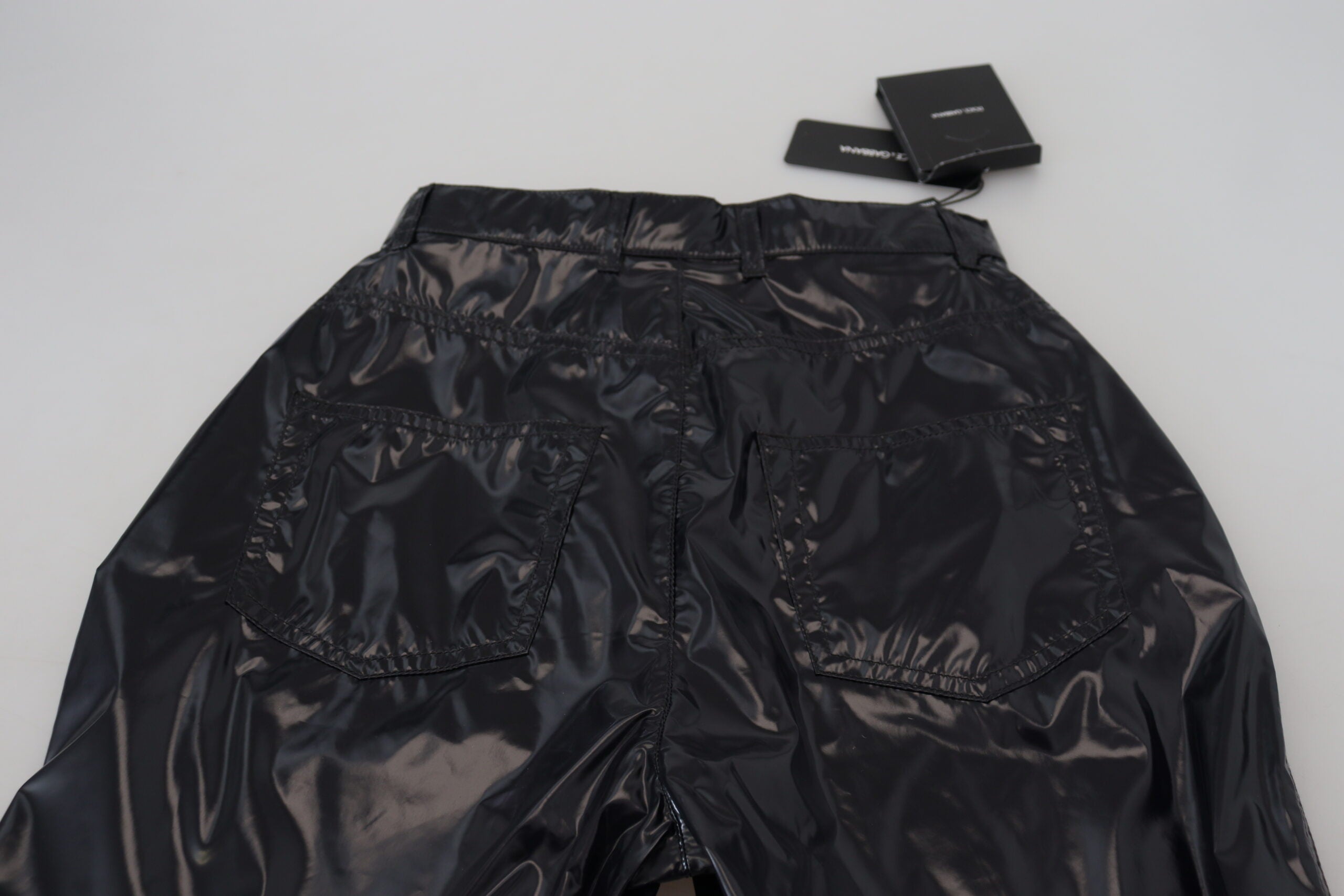 Black nylon high waist skinny pants by Dolce & Gabbana, close-up of fitted design and sleek fabric.