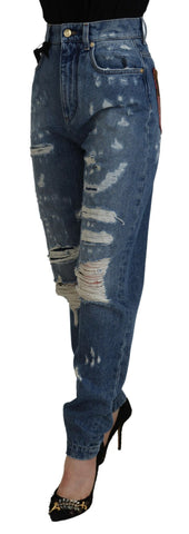 Blue tattered skinny denim jeans by Dolce & Gabbana, made of cotton, with distressed detailing and a fitted style.