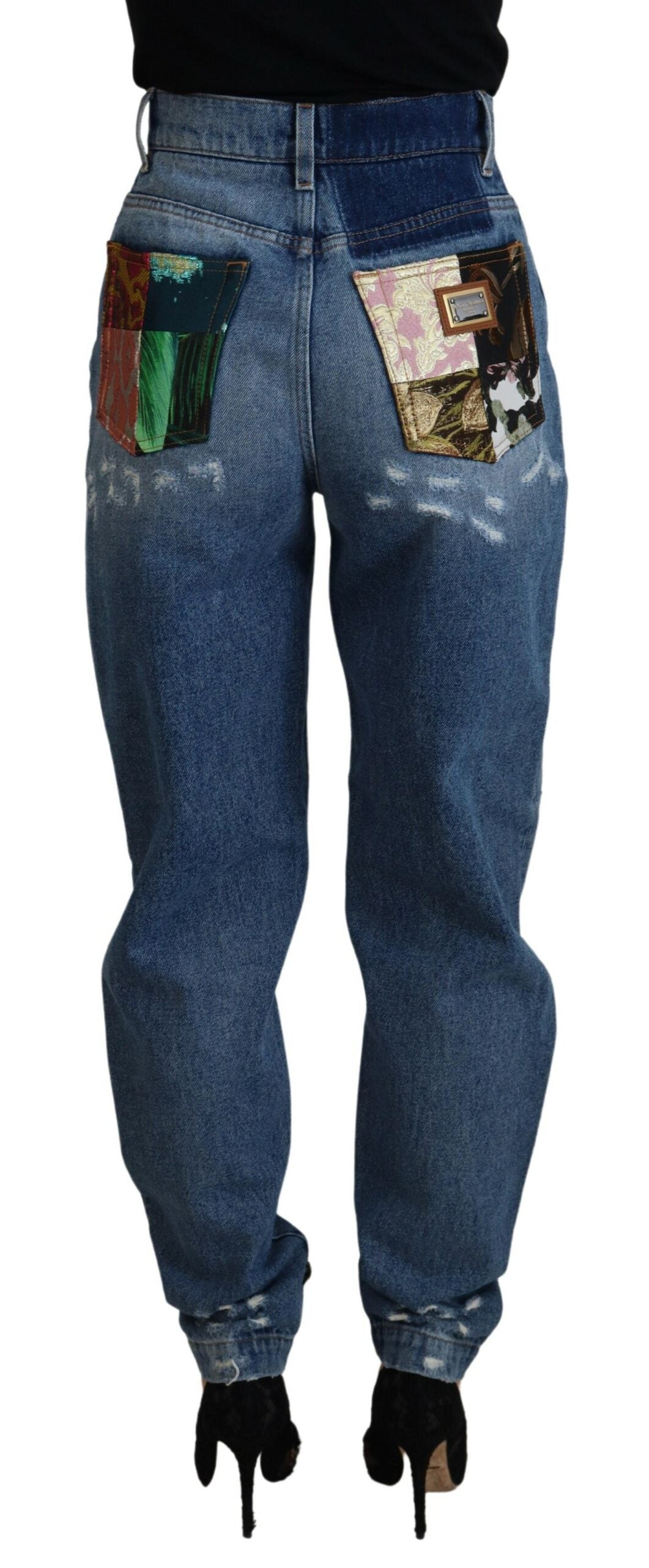 Blue tattered skinny denim cotton jeans by Dolce & Gabbana displayed on a model.