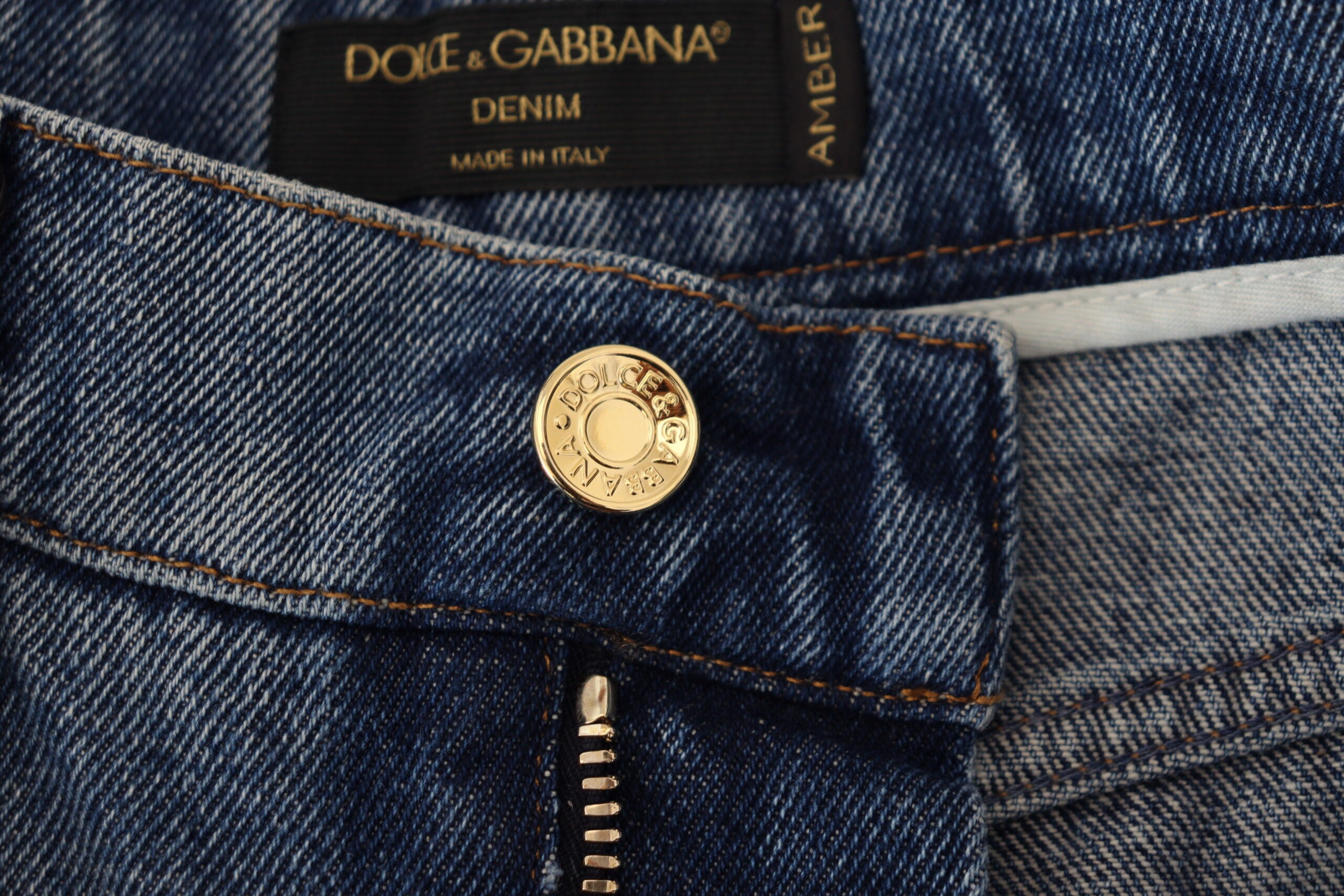 Blue tattered skinny denim cotton jeans by Dolce & Gabbana, shown with distressed details and a fitted silhouette.