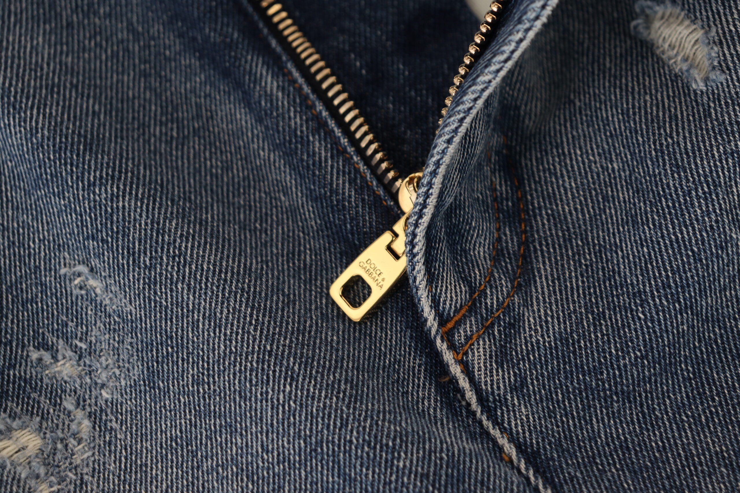 Blue tattered skinny denim cotton jeans by Dolce & Gabbana featuring distressed details and a fitted silhouette.
