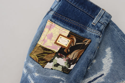 Blue tattered skinny denim cotton jeans by Dolce & Gabbana, showcasing distressed details and slim fit style.