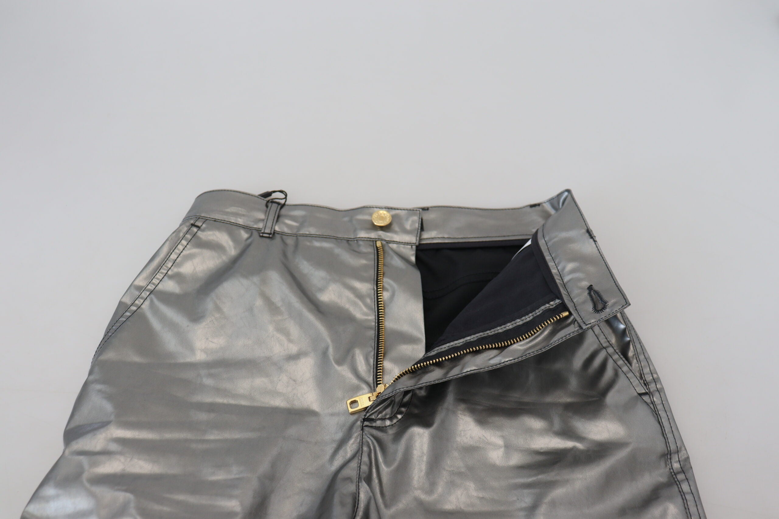 Metallic silver high waist skinny pants by Dolce & Gabbana, showing the shiny, fitted design and high-rise waist.