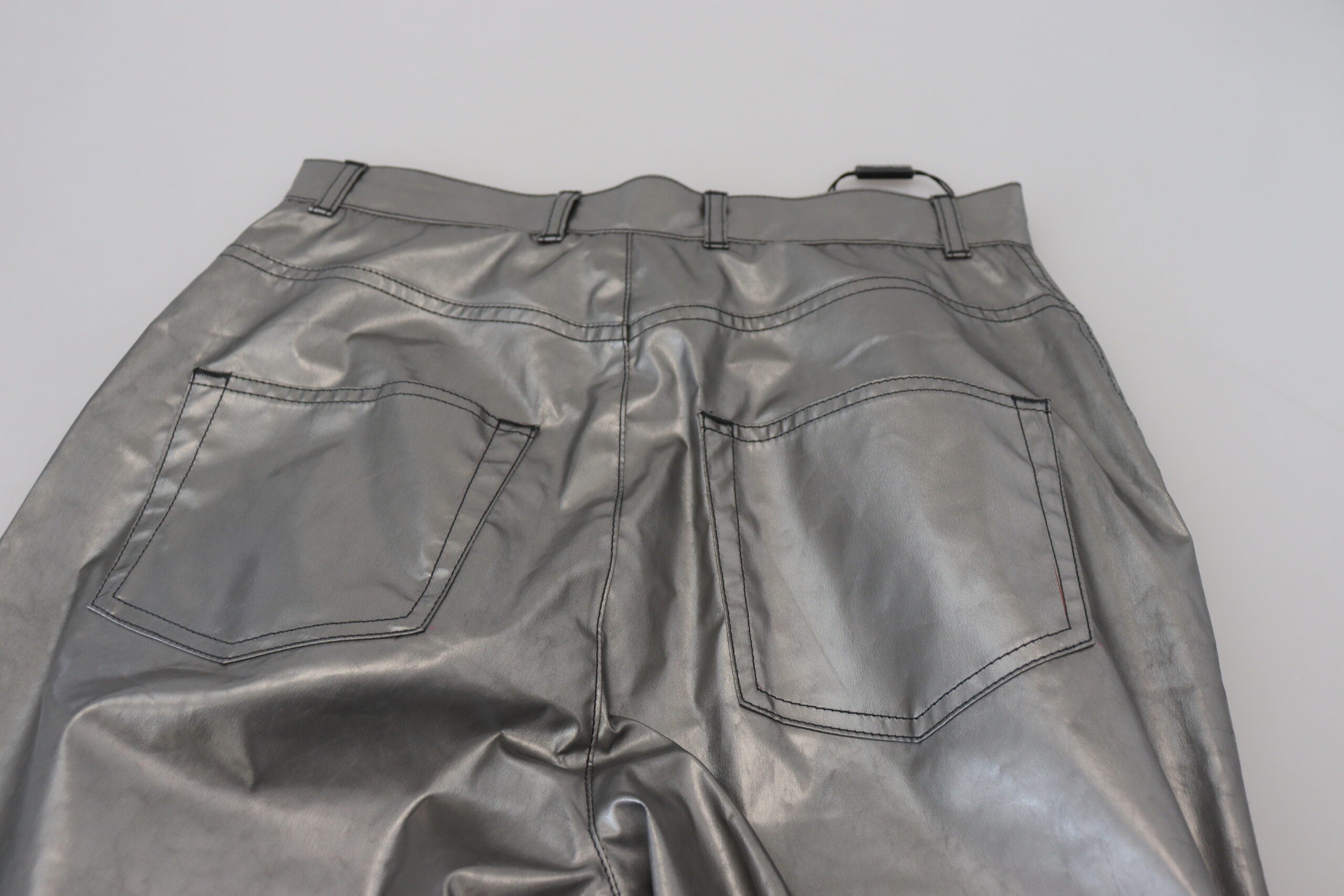 Metallic silver high waist skinny pants by Dolce & Gabbana, showcasing shiny fabric and fitted silhouette.