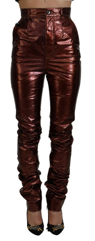 Metallic bronze high waist skinny jeans by Dolce & Gabbana, close-up of the shiny, fitted denim fabric and high-rise waist.