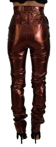 Metallic bronze high waist skinny jeans by Dolce & Gabbana, close-up of fitted denim with shiny finish and detailed stitching.